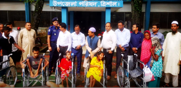 ময়মনসিংহের ত্রিশালে হুইল চেয়ার বিতরণ ও সামাজিক নিরাপত্তা বিষয়ক সেমিনার